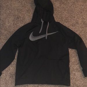Black Nike hoodie w/ grey Nike symbol.